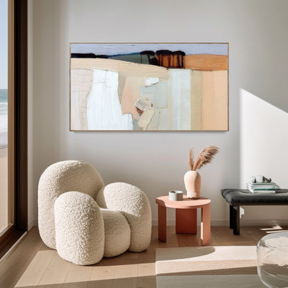 Original abstract painting enhancing a contemporary, light-filled living room with a cozy boucle chair and warm, inviting tones.
