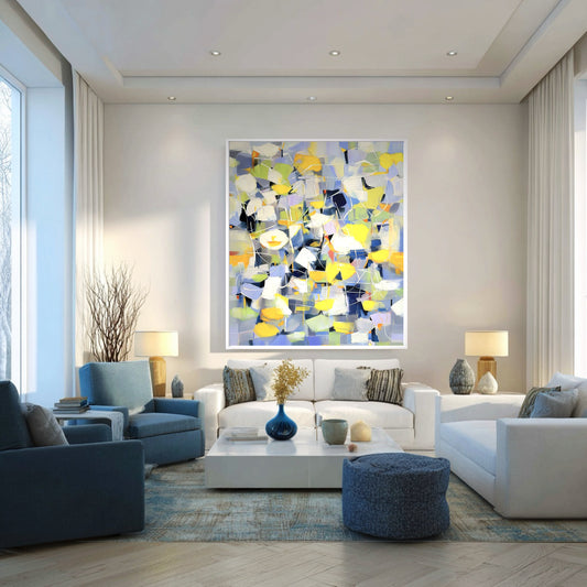 Abstract Expressionist art hangs in a contemporary living room, harmonizing with the cool blue armchairs and white sectional seating.