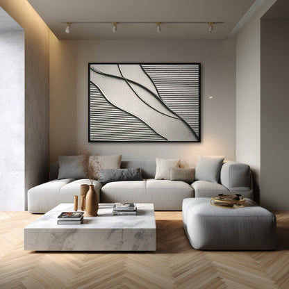 This modern monochrome artwork creates a sophisticated focal point in a bright, minimalist living room with a neutral beige sofa.