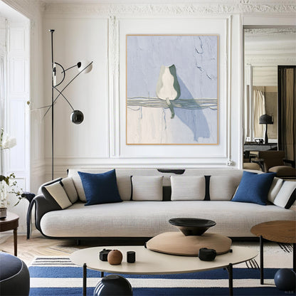 Abstract cat fine art adds a modern, simple touch above a curved sofa in a sophisticated, classic Parisian interior with molding.