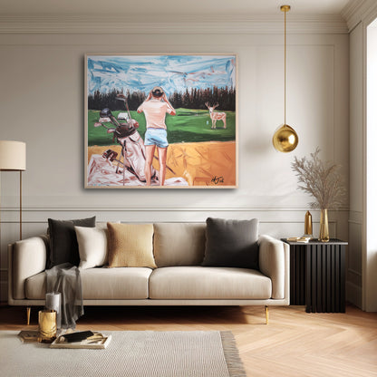 Humorous golf painting in a modern neutral living space. Orange foreground hues complement the bright throw pillows.