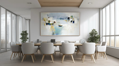 Serene abstract art creating a calm focal point in a modern conference room above the long wood table with white accent chairs.