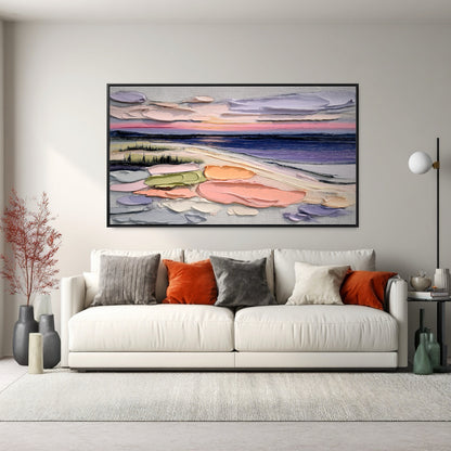 Original textured landscape art provides a burst of warm color above a white sofa; accented by orange and gray pillows for a high-contrast, bold look.