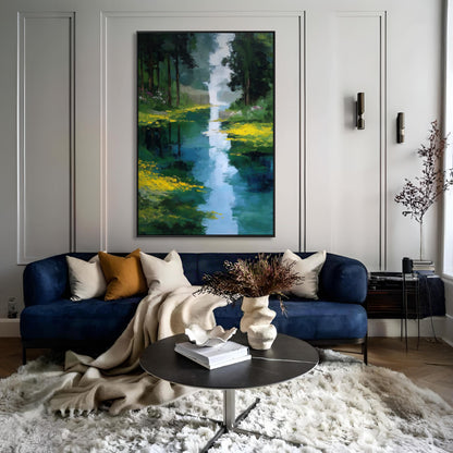 Vibrant original landscape painting acts as a cool-toned focal point above a navy velvet sofa in an elegant, minimalist gray-and-white living room.