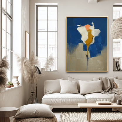 Modern blue and white painting in a bright living room. The vibrant art adds bold depth to the minimalist white furniture.