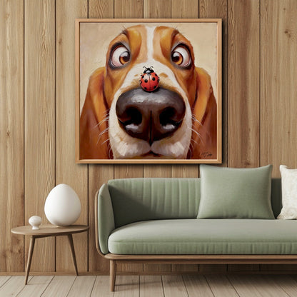 Funny Basset Hound painting hanging on a vertical wood-paneled wall above a modern sage green sofa in a cozy living room.