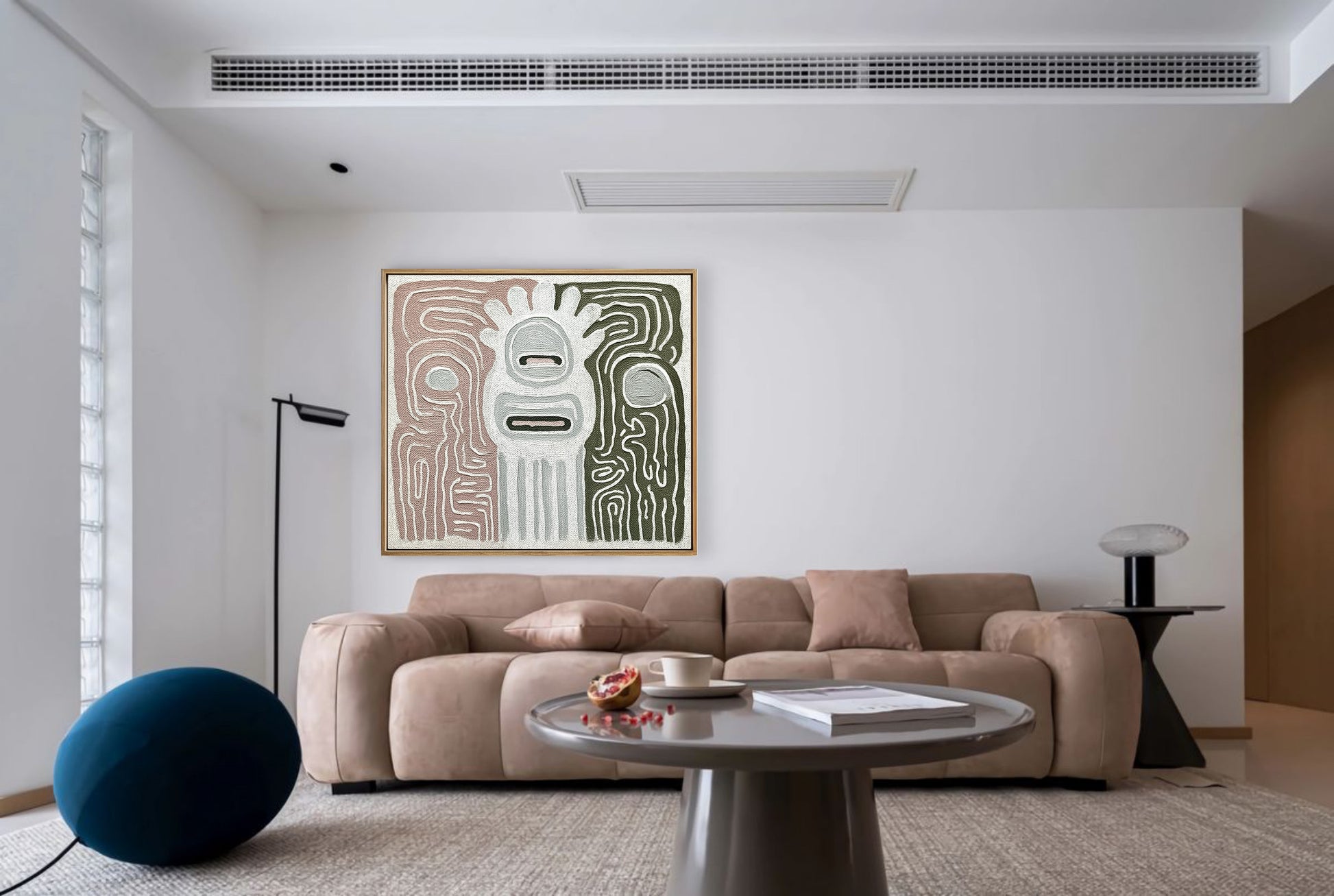 Textured abstract art anchors a minimalist living room with a soft taupe modular sofa and sculptural floor lamp.