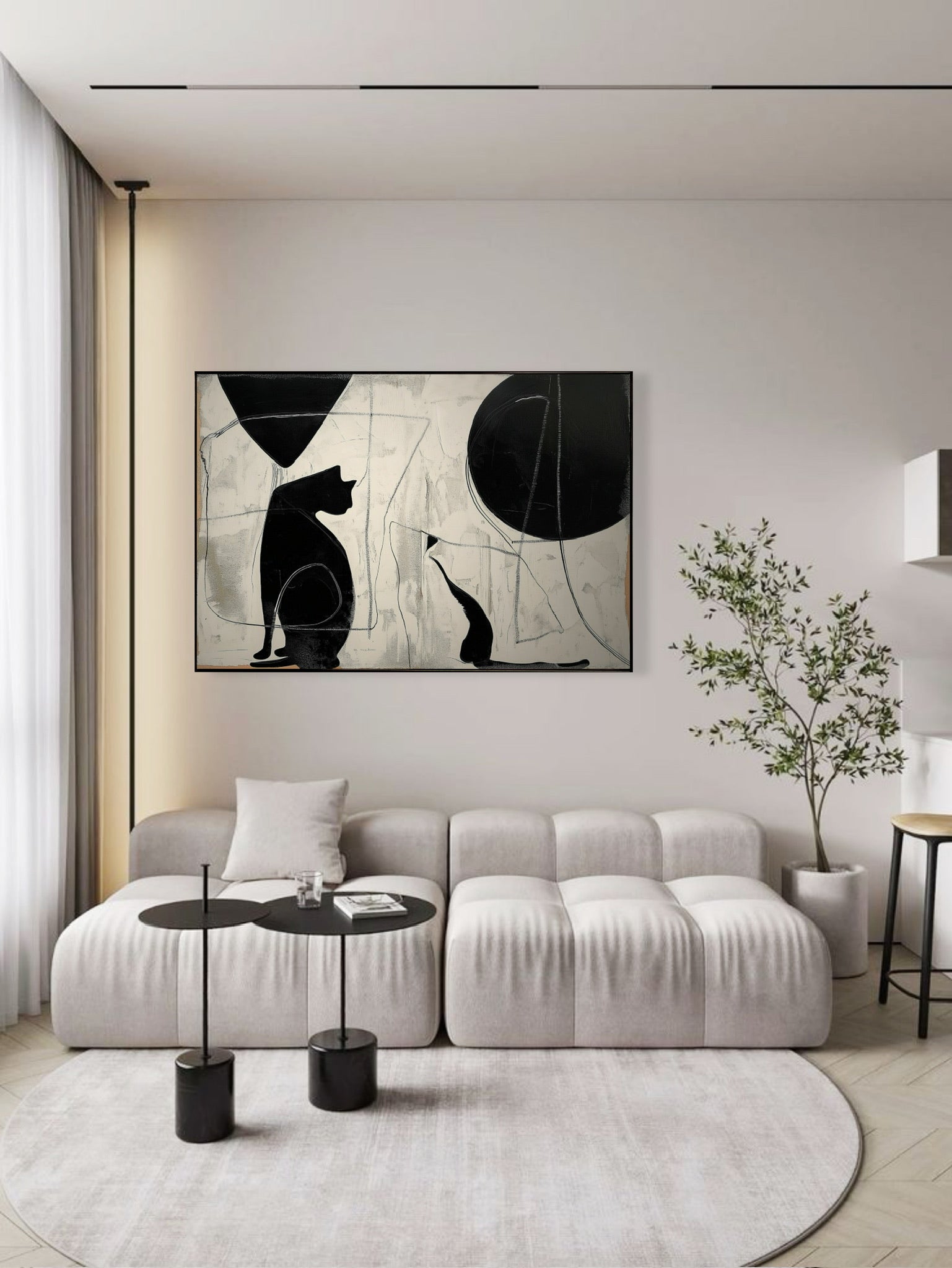 Abstract cat silhouettes provide a strong focal point over a clean, contemporary sofa with black accents in a bright, modern apartment.