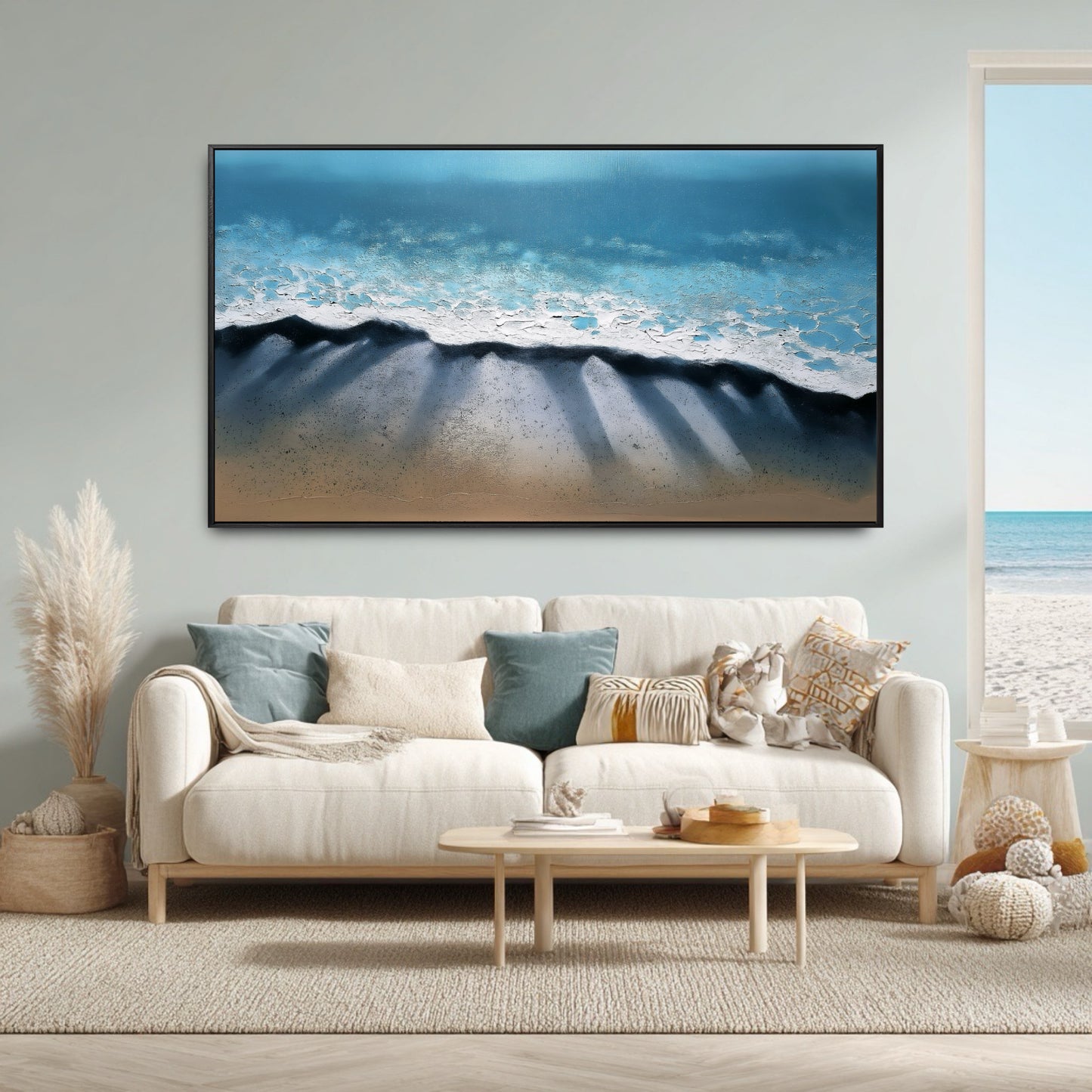The abstract ocean painting's colors and beach theme perfectly match the airy, coastal boho decor and the room's ocean view.