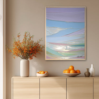 The abstract painting's cool pastel colors create a soft contrast with the warm orange berries and wood console table beneath it.