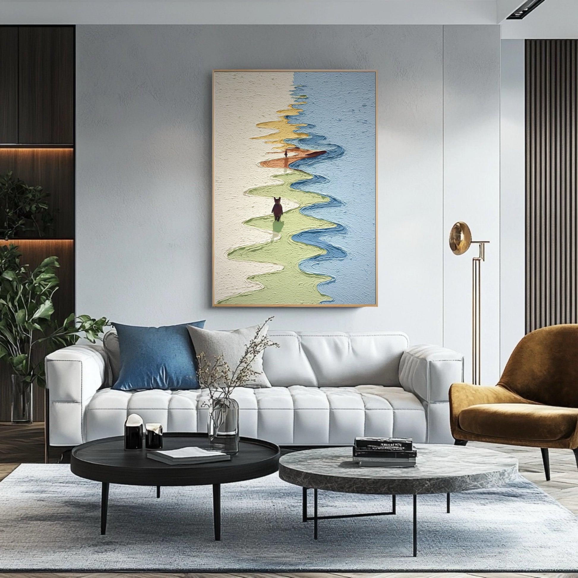 Textured fine art adds a winding path of color above a minimalist white sofa in a sleek, contemporary living room with dark accents.