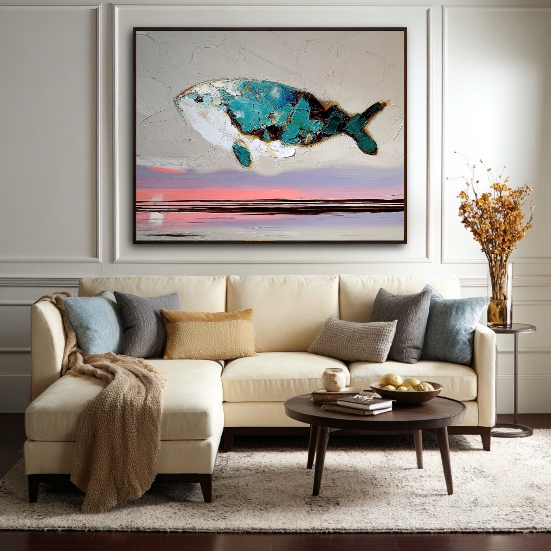 A large abstract whale painting hangs in a traditional living room with wall molding, above a cream-colored sectional sofa.