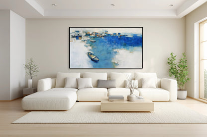 Abstract blue harbor art enhancing the light, airy feeling over a white sofa, perfectly matching the modern pillows' soft yellow accents.