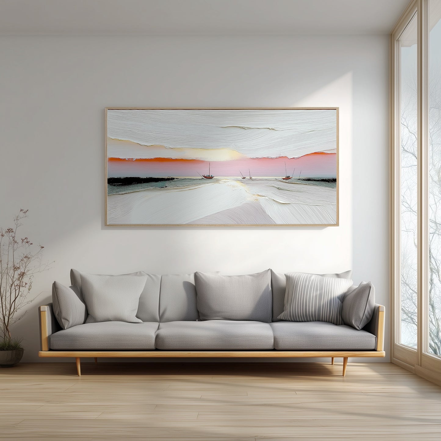 In a bright, minimalist room, the abstract sunset painting provides a essential splash of warm color above a sleek, modern gray sofa.