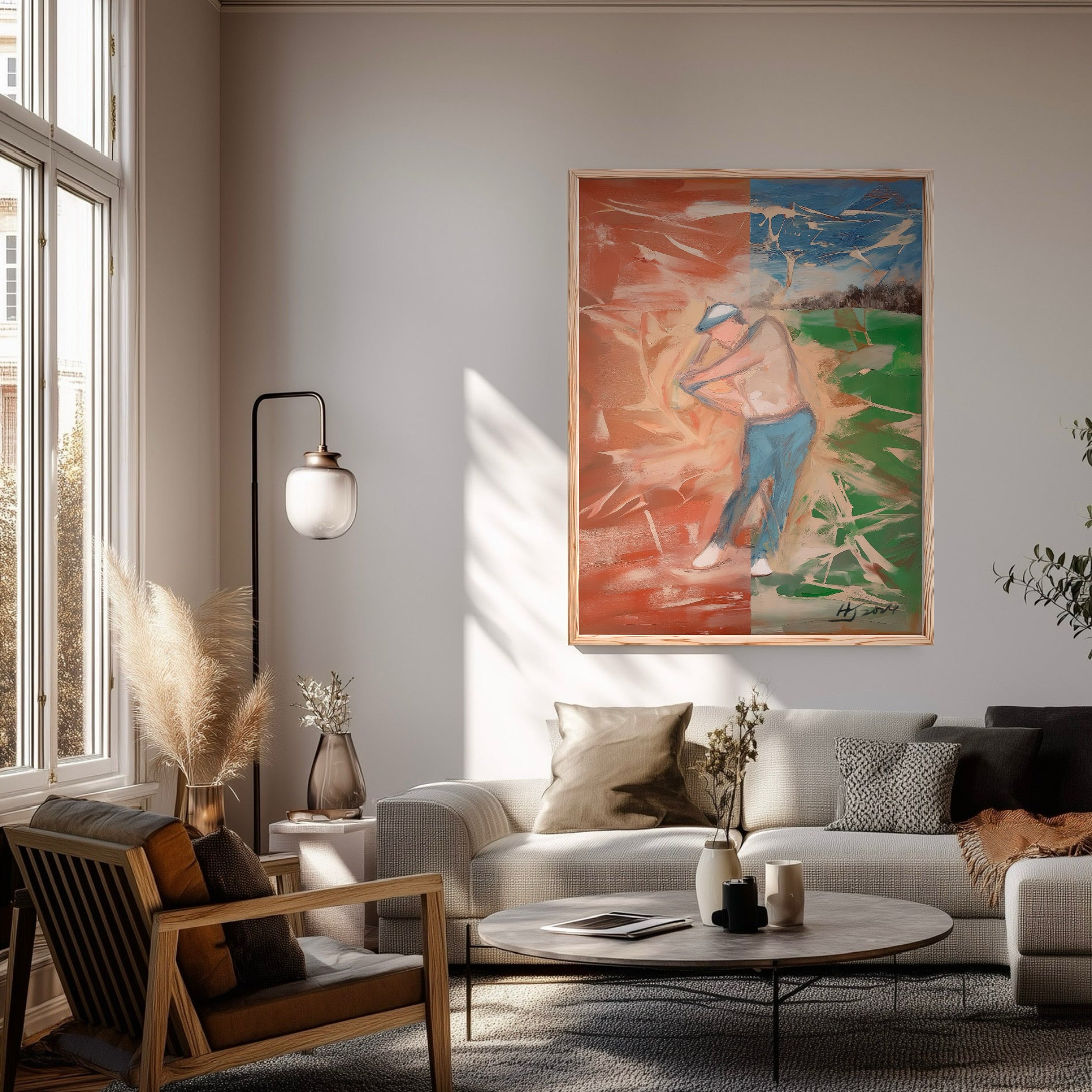 Impressionist golf canvas in a sunlit modern living room. Vibrant split colors add energy above a neutral grey sofa and lamp.