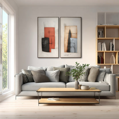 Modern abstract canvas set provides a graphic, contrasting focal point above a gray couch, set against a light wood floor and contemporary bookshelf.