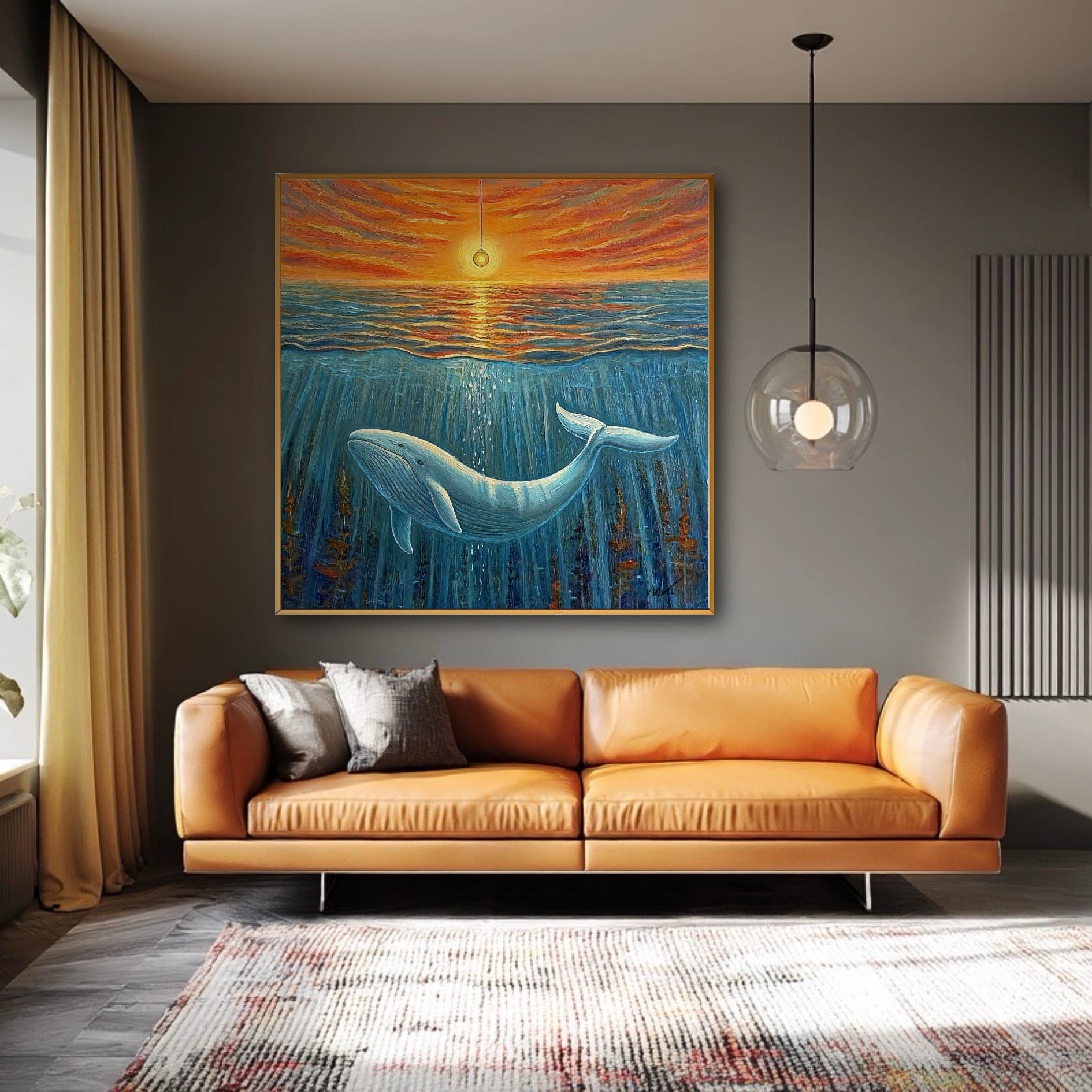 A vibrant whale and sunset painting is mounted on a dark gray wall, contrasting beautifully with a modern orange leather sofa.