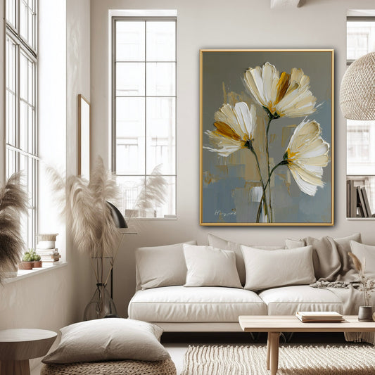 Large textured flower art in a bright minimalist apartment. The cool grey canvas anchors the sunlit space and white furniture.