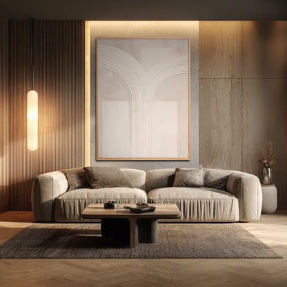 Large white plaster art on a backlit wood accent wall above a modern grey sofa in a contemporary living room.