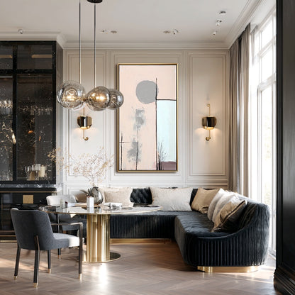 Modern living room with a stylish sofa, dining table, and decorative elements.