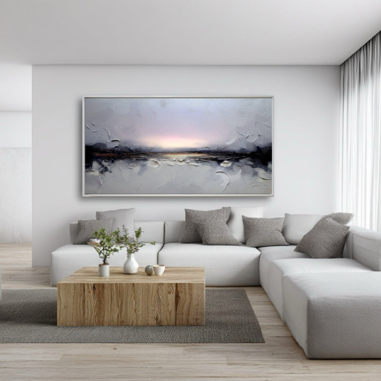 Modern living room with a gray sectional sofa, wooden coffee table, and abstract artwork on the wall.