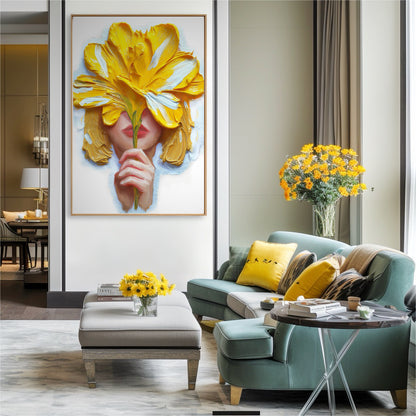 Vibrant yellow and white artwork brightens a stylish living area. The dynamic painting acts as a colorful statement above a teal sofa, illuminated by natural light from a large window.