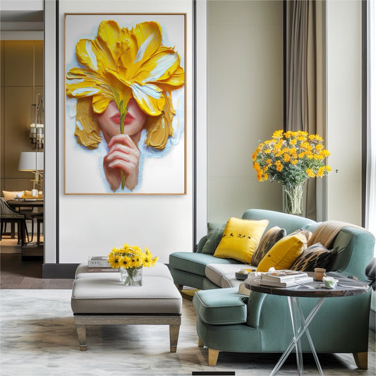 Vibrant yellow and white artwork brightens a stylish living area. The dynamic painting acts as a colorful statement above a teal sofa, illuminated by natural light from a large window.