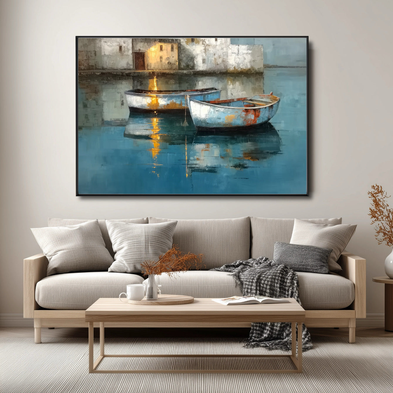 Coastal boat artwork above a light wood sofa in a neutral modern living room with gray and white soft furnishings.