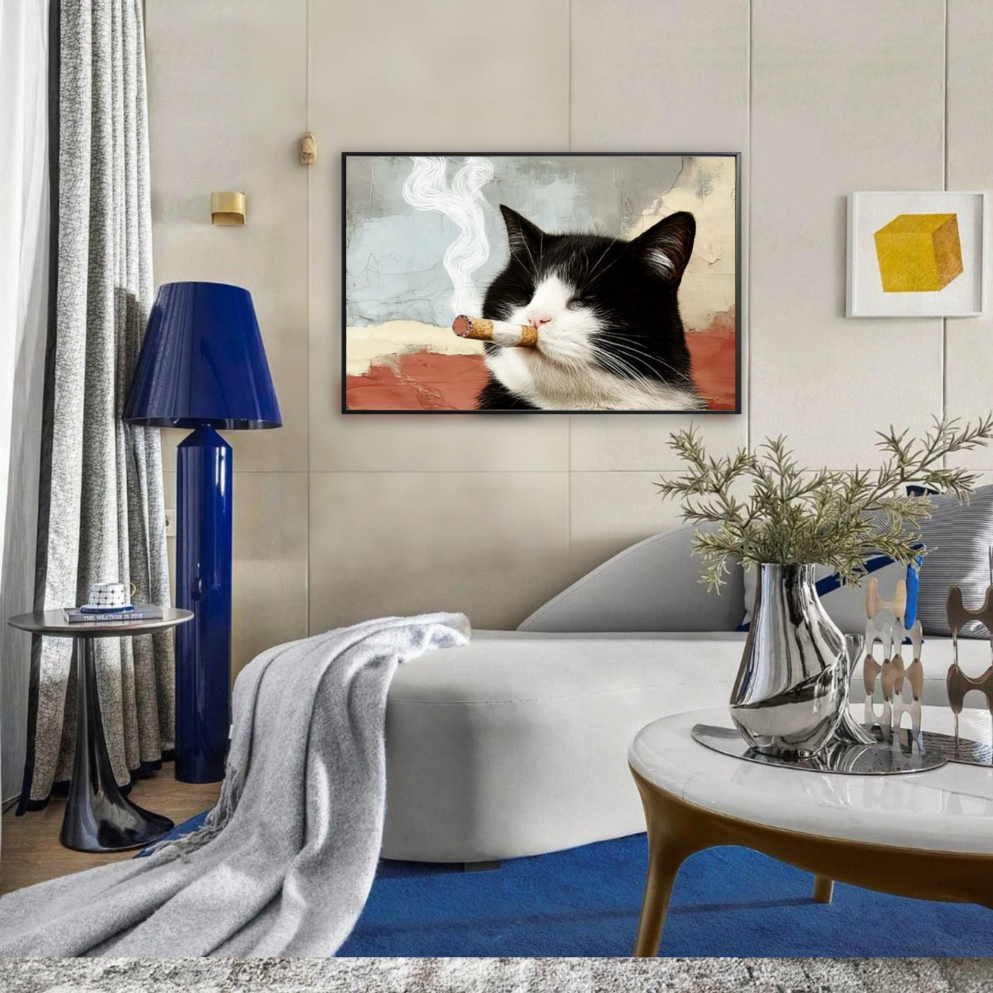 Unique cat painting complementing a chic white sofa and bold blue accents, lending a quirky, artistic flair to a sleek living area.