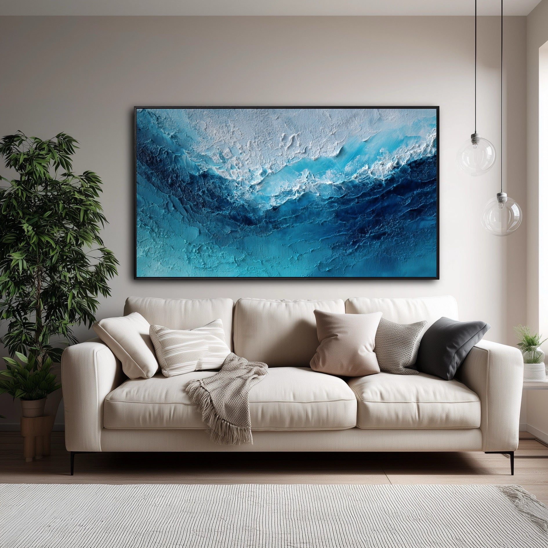 The vibrant blue abstract painting creates a stunning, energetic focal point, adding a pop of cool color to the neutral cream sofa.