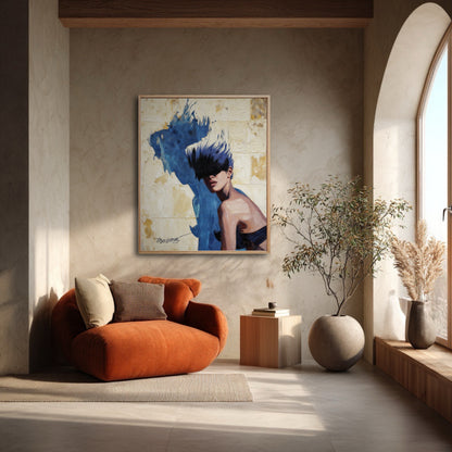 Framed modern painting of a woman hanging in a calm, minimalist room next to an arched window and an orange armchair.