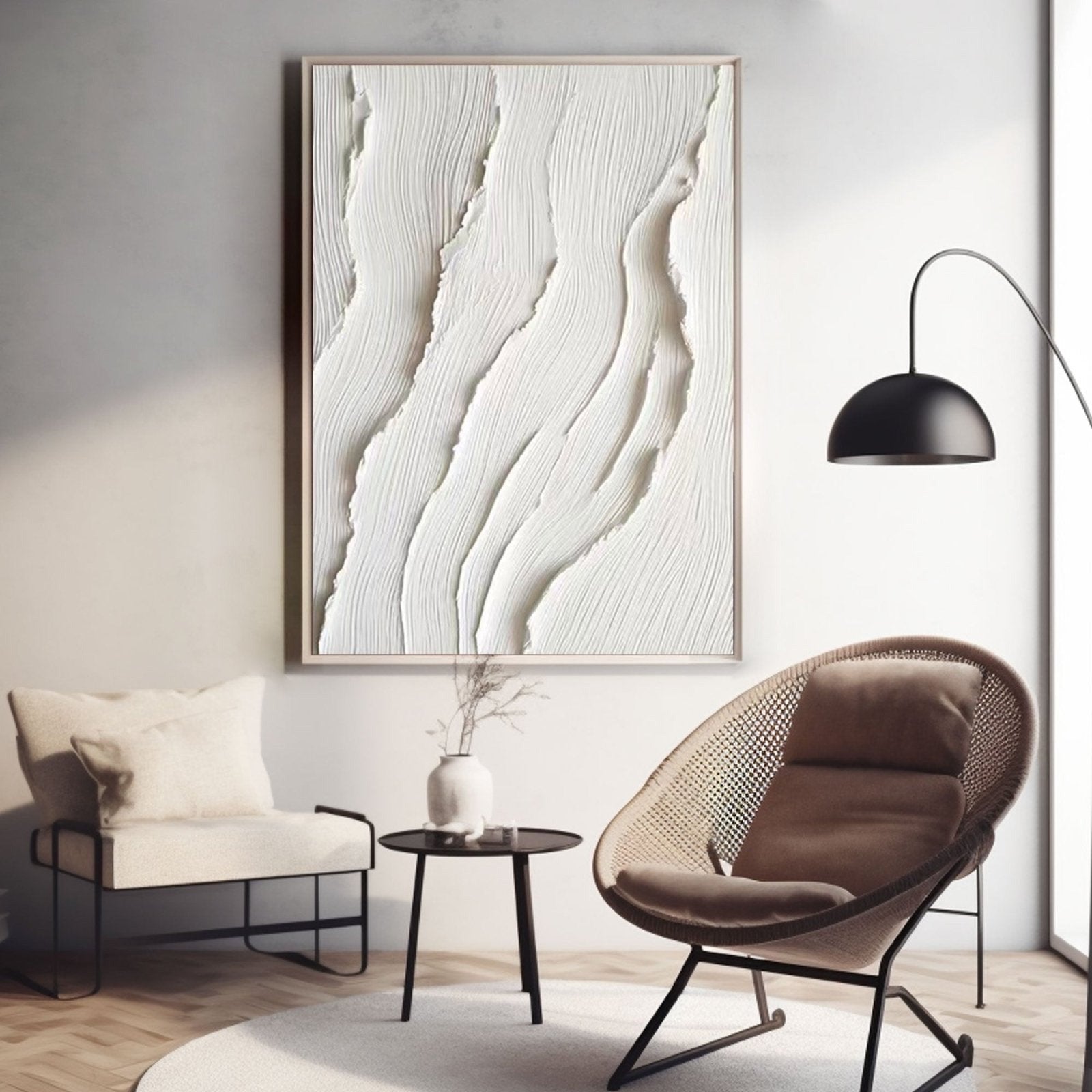 Original relief art above a cozy reading nook with a rattan cane chair and a minimalist black accent lamp.