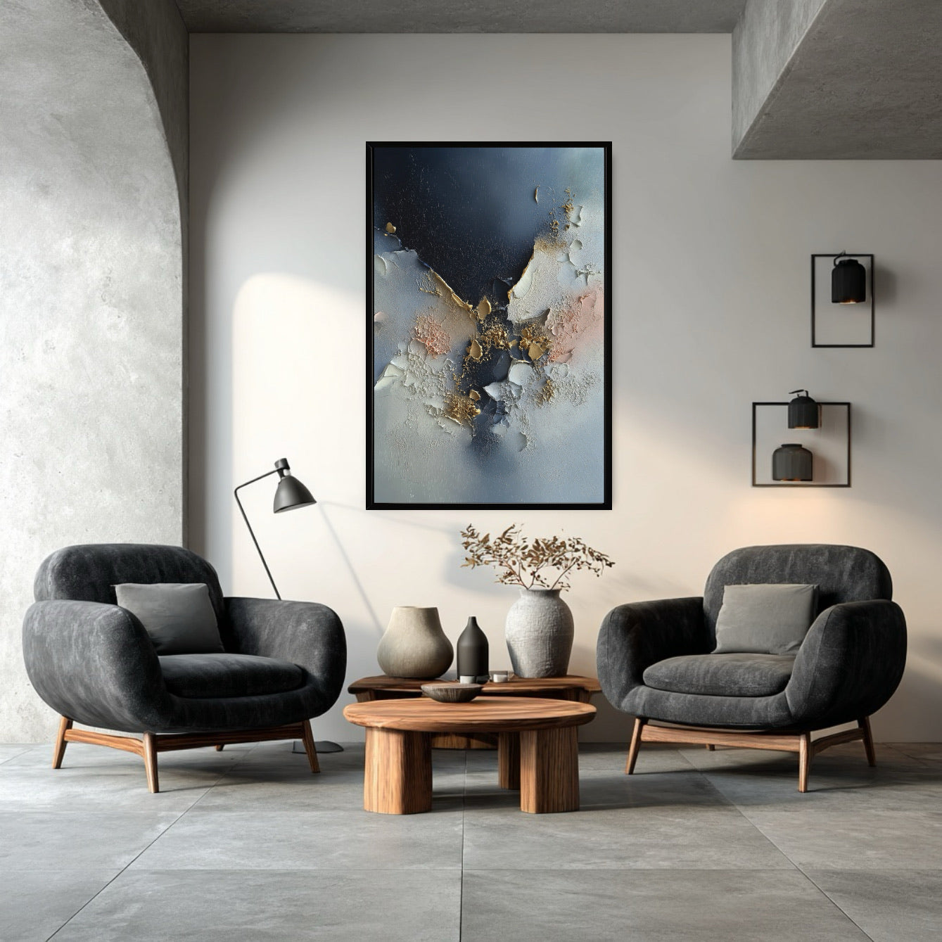 Textured abstract painting above two charcoal gray armchairs, anchoring a moody, modern conversation area with raw concrete details.