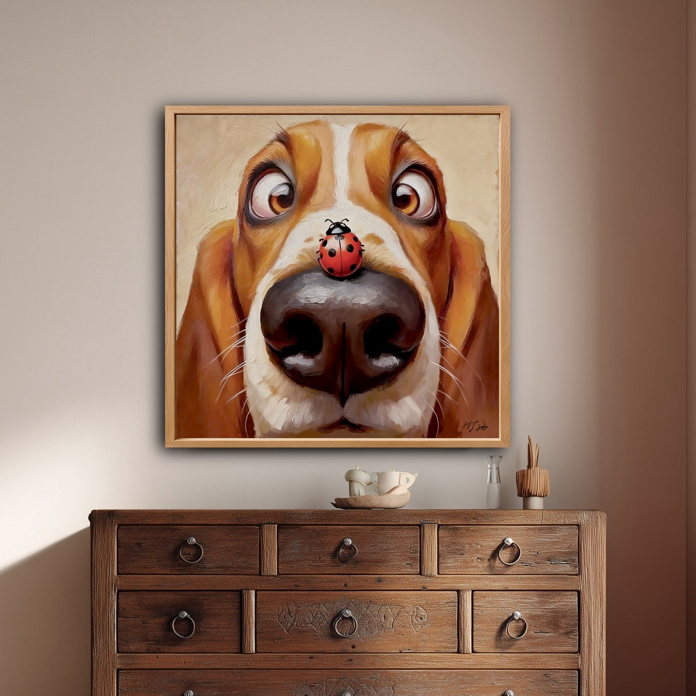 Whimsical Basset Hound art hanging on a beige wall above a dark, rustic wood dresser with multiple drawers and ring pulls.