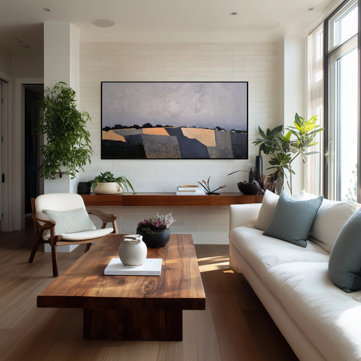 Original abstract fields painting central to a natural wood-toned living space. Surrounded by lush plants, creating an earthy, serene decor.