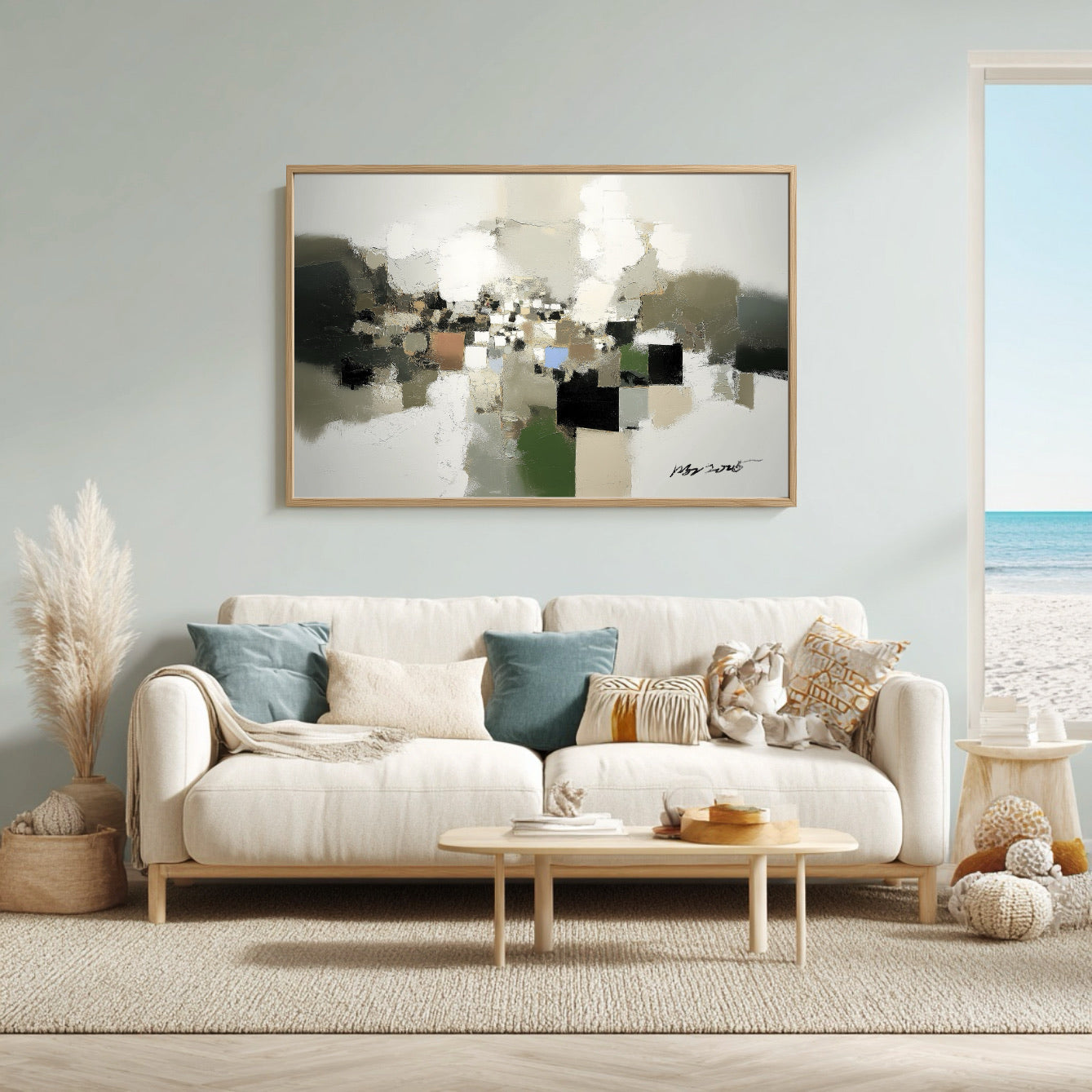 Living room with a white sofa, abstract art, and decorative items.