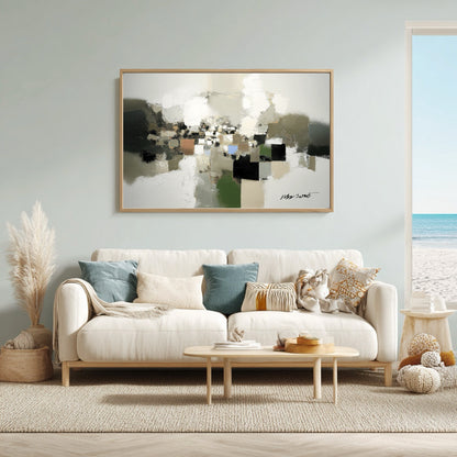 Living room with a white sofa, abstract art, and decorative items.
