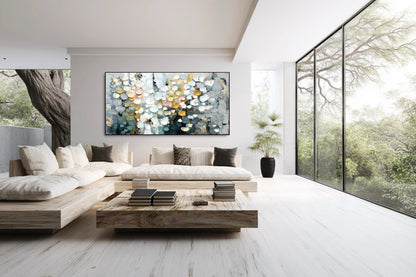 Abstract impasto painting creates a focal point in a bright, original minimalist lounge with natural light and outdoor views.