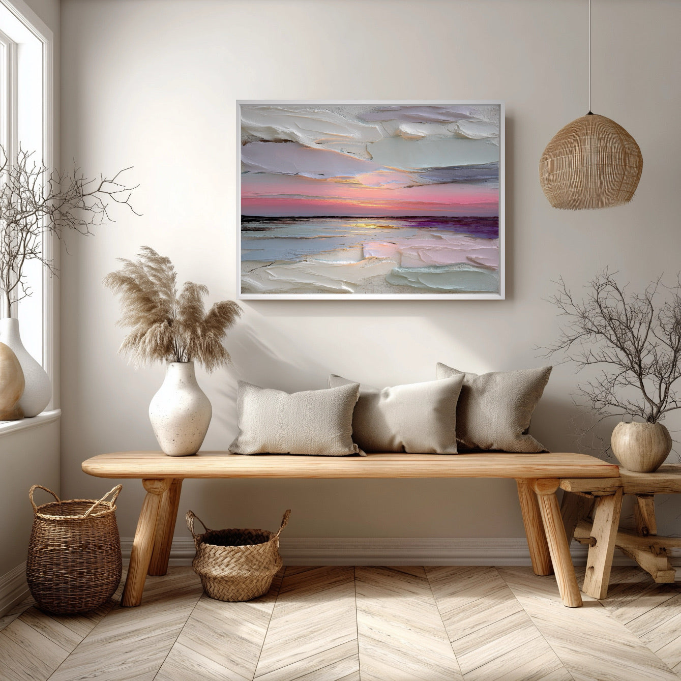 Large textured seascape art echoes the ocean view from the window, harmonizing with the white sofa, blue rug, and light coastal decor.