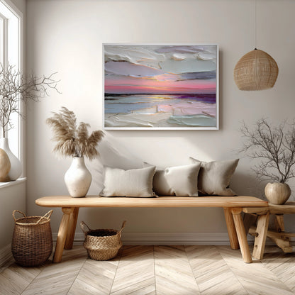 Large textured seascape art echoes the ocean view from the window, harmonizing with the white sofa, blue rug, and light coastal decor.