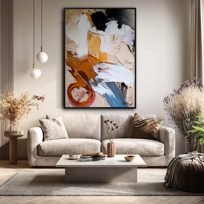 Original abstract painting with thick texture hanging above a plush beige sofa in a bright, cozy, modern room.
