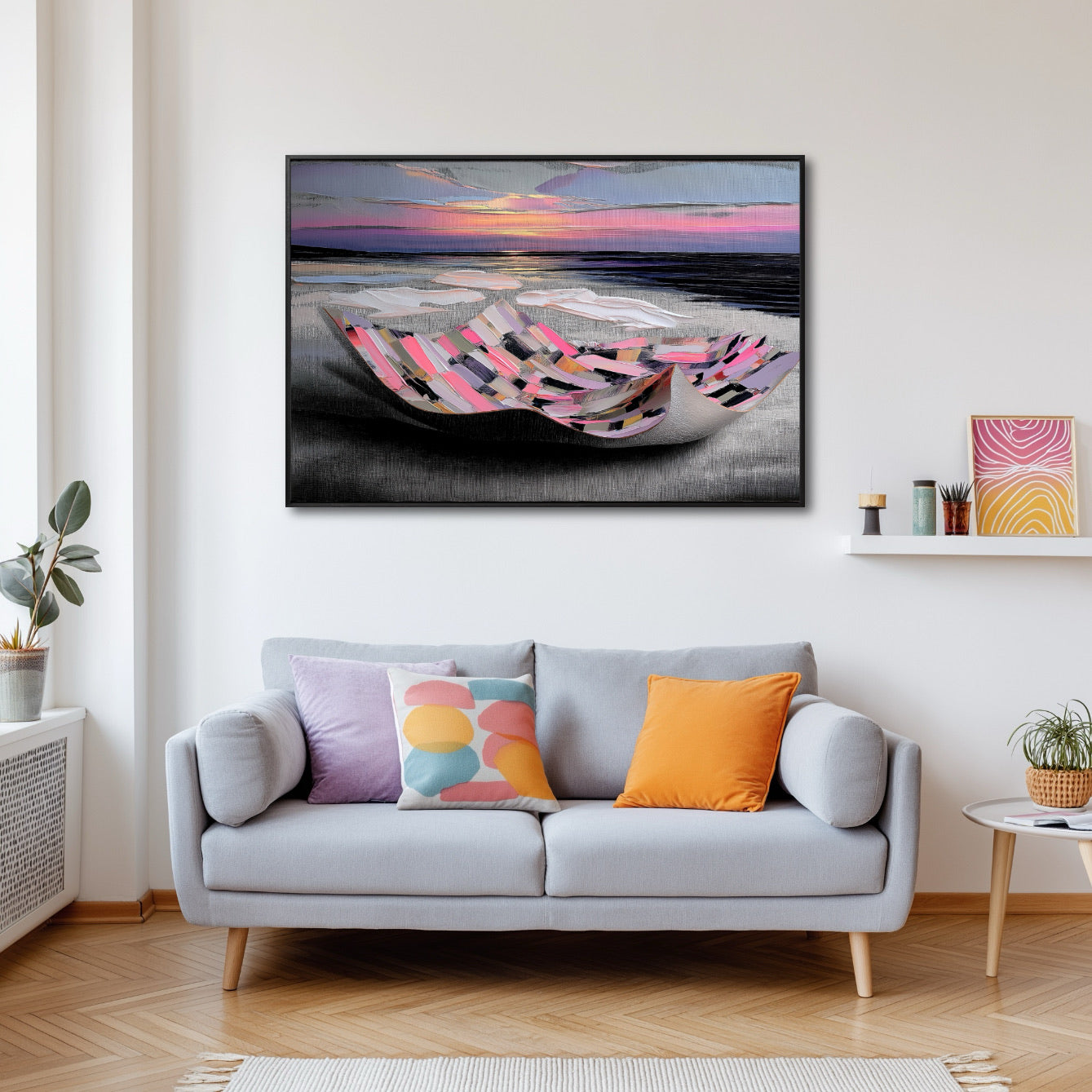 Colorful textured art over a gray sofa with playful, brightly colored cushions in a bright, modern, and cheerful space.