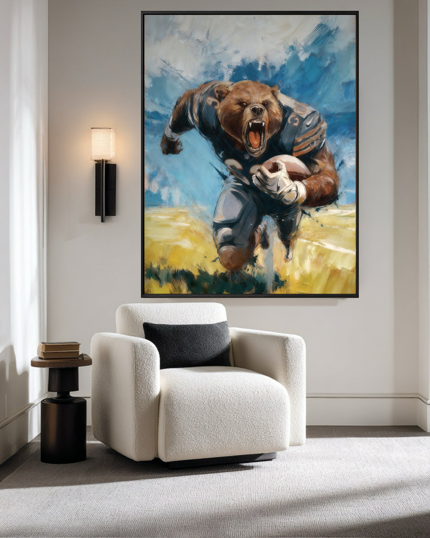 Framed painting of a Chicago Bears mascot in a modern reading nook with a white boucle armchair and a sleek wall sconce.