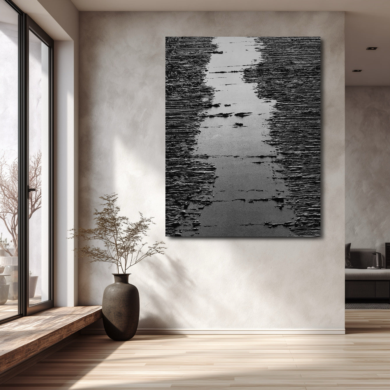 Original art on textured wall, enhancing minimalist, sunlit interior with high window and dark vase. Strong vertical impact.