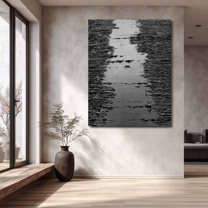 Original art on textured wall, enhancing minimalist, sunlit interior with high window and dark vase. Strong vertical impact.
