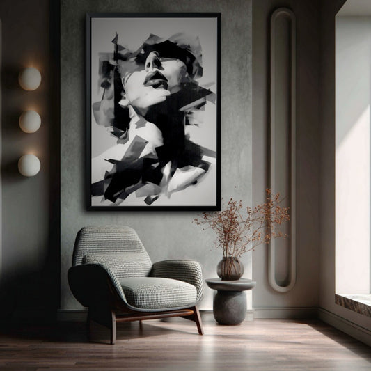 Framed abstract woman's portrait in a modern reading corner with a stylish grey armchair and minimalist wall sconces.
