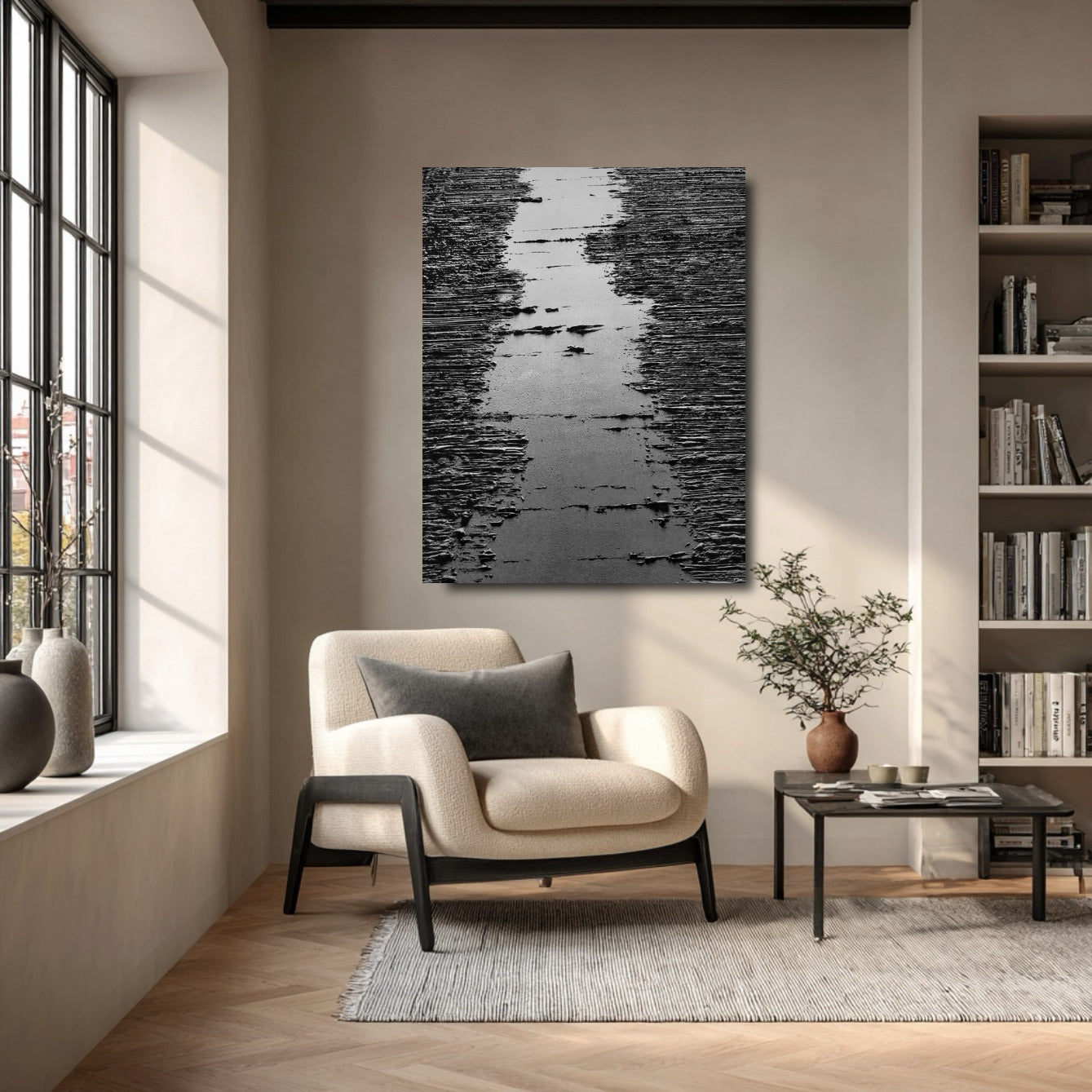 Abstract original painting grounding a cozy reading nook with a plush armchair and a full bookshelf. Adds depth to the small space.