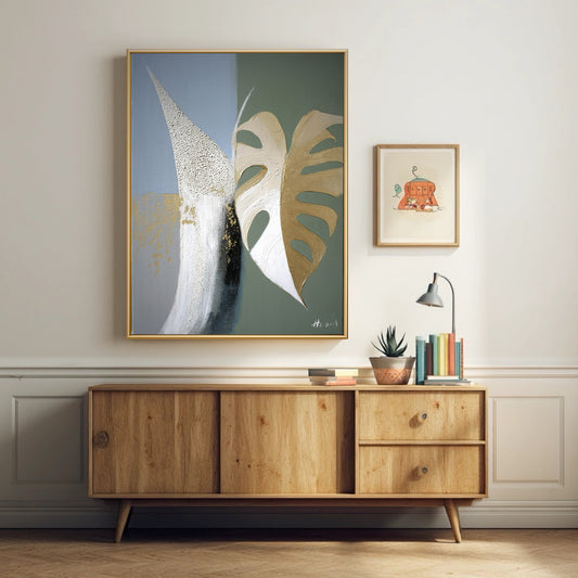 Modern abstract wall art styled over wooden console table. Cool blue & green painting adds color to mid-century modern home decor.