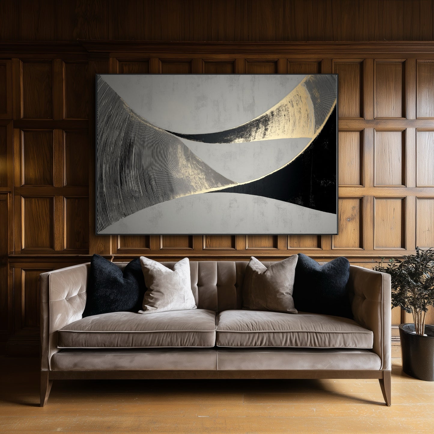 Large black and gold abstract painting on a classic dark wood paneled wall above a velvet sofa in a formal library.
