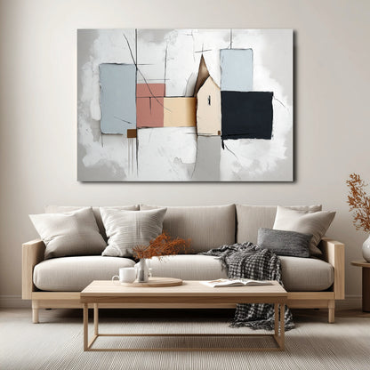 Abstract cottage art hangs over a low-profile wood and gray sofa, blending soft neutral colors with the Scandinavian-style living room decor.